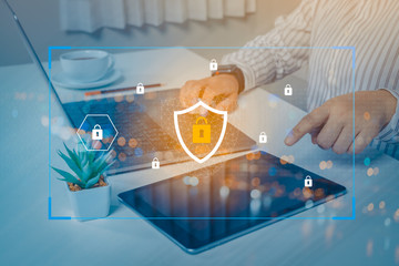 Person using a laptop computer with technology cybersecurity and privacy concept. protection and safe data for global network security.