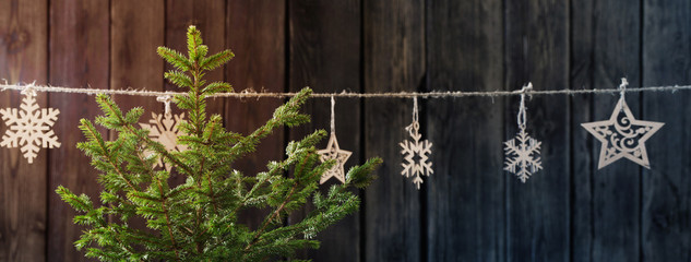 Christmas tree on dark wooden background