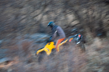 ATV descends from the mountain. Photo in dynamics.