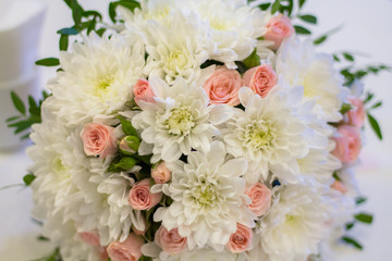 Wedding bouquet with white asters and pink roses. Background for the decor of wedding products
