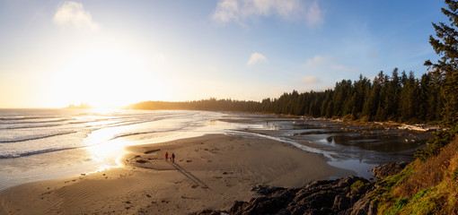 Long Beach, Near Tofino and Ucluelet in Vancouver Island, BC, Canada. Beautiful panoramic view of a sandy beach on the Pacific Ocean Coast during a vibrant sunset.