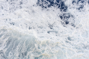Abstract blue sea water with white foam for background, nature background concept