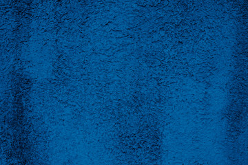 Background of vintage stone wall texture, natural pattern in trendy classic blue color