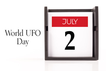 July, 2 - World UFO Day. Calendar on white background, greeting message conceptual image.