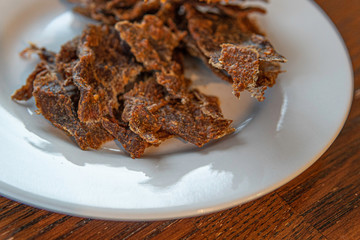 Dried meat called Kilishi in Nigeria. The meat is sliced into thin sheets and dried, salted and spiced.