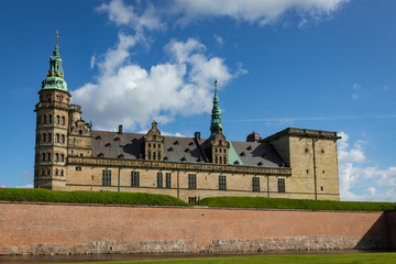 Fototapeta na wymiar Scenic Kronborg Castle Looms Above Brick Wall and Moat