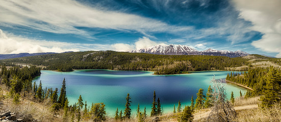 Panorama of Emerald Lake, It is located in the Yukon Territory of Canada. - obrazy, fototapety, plakaty