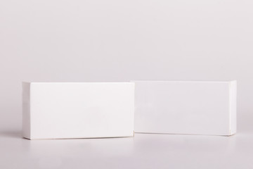 White pills box. Plastic bottles. Drugs box mock-up. Medical blank cardboard. Mockup. Pills bottle