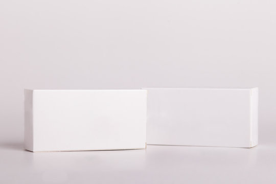 White pills box. Plastic bottles. Drugs box mock-up. Medical blank cardboard. Mockup. Pills bottle