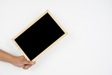 Mens hand holding blackboard over white background. Copy space concept