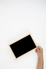 Mens hand holding blackboard over white background. Copy space concept