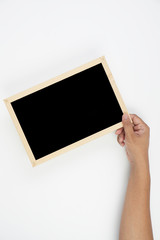 Mens hand holding blackboard over white background. Copy space concept