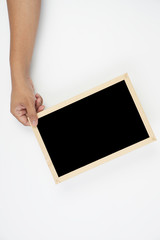 Mens hand holding blackboard over white background. Copy space concept