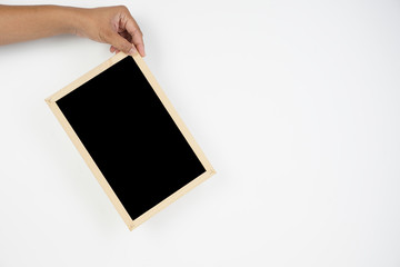 Mens hand holding blackboard over white background. Copy space concept
