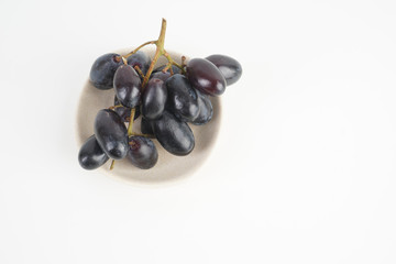 Fresh grape fruits plated over the white background