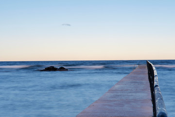 Obraz premium Bath pier during sunrise at island of Gotland, Sweden
