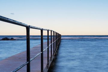 Fototapeta premium Bath pier during sunrise at island of Gotland, Sweden