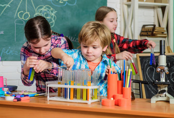 Practicum based teacher professional development program. Practical knowledge. Child care and development. School classes. Kids adorable friends having fun in school. School chemistry lab concept