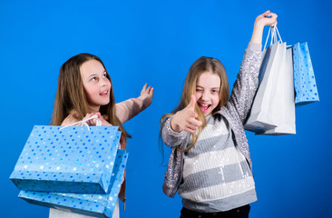 Shopping day happiness. Happy children in shop with bags. Sisters shopping together. Buy clothes. Fashionista addicted buyer. Fashion boutique kids. Shopping is best therapy. Shopping of her dreams