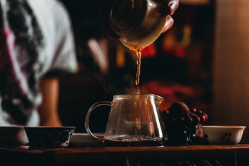 tea ceremony, pouring tea, a Chinese tea closeup. selective focus