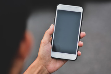 Business people holding cell phone or mobile smart phone technology communication