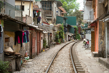 Fototapeta na wymiar Street with train tracks, Hanoi, Vietnam　ベトナム・ハノイ 線路沿いの街並み