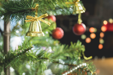 Bells are hung on Christmas trees to decorate the Christmas or New Year holidays. There is space for the copy space.