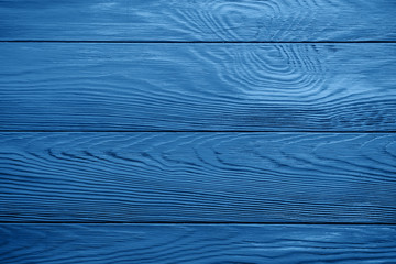 Classic blue color of 2020 wooden board textured background