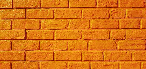 Pattern yellow brick wall painted for background. Art wallpaper and Architecture Exterior design concept 