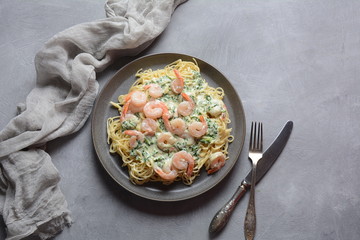 Italian Spaghetti or Pasta with shrimps, garlic and herbs in a creamy Alfredo sauce. Keto diet food concept
