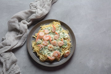 Italian Spaghetti or Pasta with shrimps, garlic and herbs in a creamy Alfredo sauce. Keto diet food concept