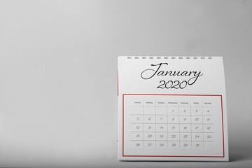 Paper calendar on grey background, space for text. Planning concept