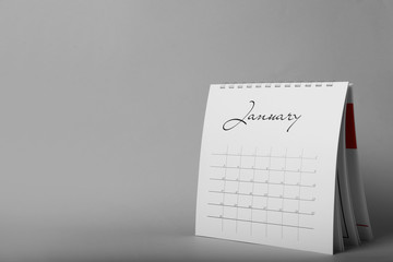 Paper calendar on grey background, space for text. Planning concept