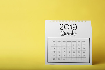 Paper calendar on yellow background. Planning concept