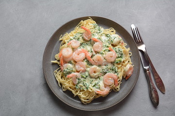 Italian Spaghetti or Pasta with shrimps, garlic and herbs in a creamy Alfredo sauce. Keto diet food concept