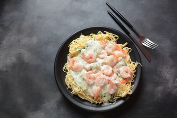 Italian Spaghetti or Pasta with shrimps, garlic and herbs in a creamy Alfredo sauce. Keto diet food concept