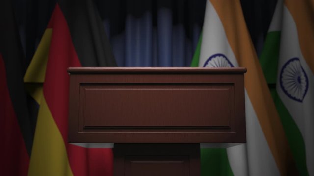 Flags of Germany and India and speaker podium tribune. Political event or negotiations related conceptual 3D animation