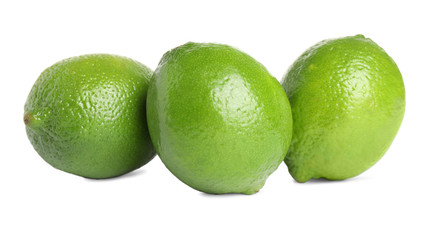 Fresh green ripe limes isolated on white