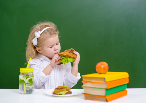 child eats lunch at school
