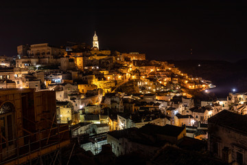 Fototapeta na wymiar Night landscape of the Sassi of Matera, well-known for their ancient cave dwellings. Basilicata. Italy