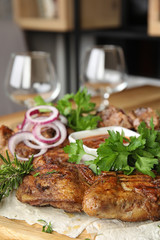 Delicious roasted chicken tobacco with herbal on wooden board, closeup