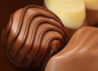 chocolate praline or sweets closed up food background
