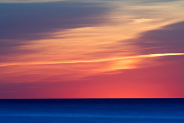 Beautiful deep blue ocean with amazing color sunset in background in the Baltic Sea, Sweden