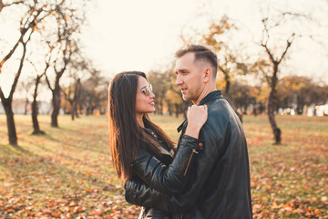 Loving couple hugging tenderly - a beautiful girl and a tall man