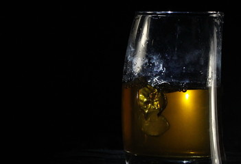 glass of whiskey with ice  and copy space