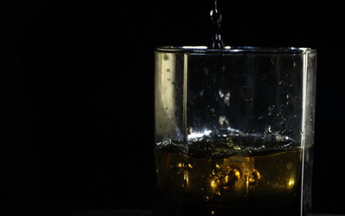 glass of whiskey with ice  and copy space