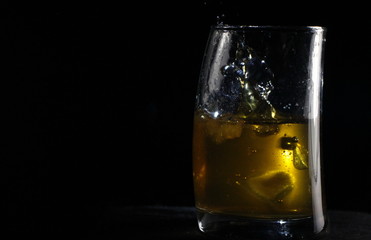 glass of whiskey with ice