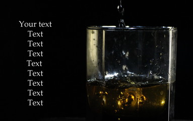 glass of whiskey with ice  and copy space