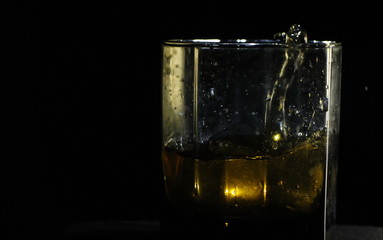 glass of whiskey with ice