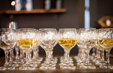 rows of wine glasses on corporate party celebration